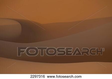 Stock Photograph - Morocco, Detail of sand dunes at dawn in Erg Chebbi area; Sahara Desert near Merzouga. Fotosearch