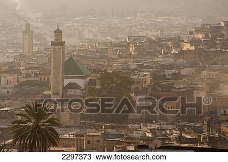 Stock Image - Morocco, Looking down to Kairaouine Mosque and medina of Fez at dawn; Fez. Fotosearch