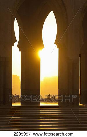 Morocco, Looking through arches of Hassan II mosque at dusk; Casablanca View Large Photo Image Stock Photo - Morocco, Looking through arches of Hassan II mosque at dusk; Casablanca. Fotosearch