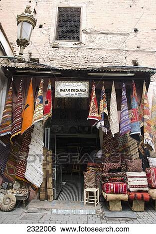 Morocco, Marrakech, Medina, Colorful fabric and rugs for sale View Large Photo Image Stock Photograph - Morocco, Marrakech, Medina, Colorful fabric and rugs for sale. Fotosearch