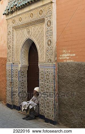 Morocco, Marrakech, Medina, Senior man sitting in doorway View Large Photo Image Stock Photograph - Morocco, Marrakech, Medina, Senior man sitting in doorway. Fotosearch