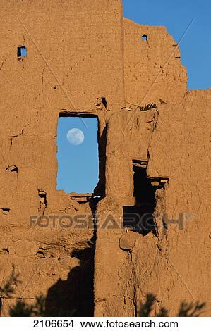 Picture - Morocco, Moon rising behind ruins of old kasbah; Skoura. Fotosearch