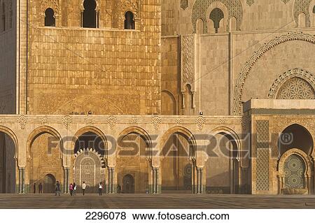 Stock Photo - Morocco, People walking across huge courtyard in front of Hassan II mosque; Casablanca. Fotosearch