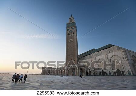 Morocco, People walking across courtyard in front of Hassan II mosque at dusk; Casablanca View Large Photo Image Stock Image - Morocco, People walking across courtyard in front of Hassan II mosque at dusk; Casablanca. Fotosearch