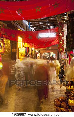 Stock Photo - Morocco, People walking on street at night; Marrakesh. Fotosearch