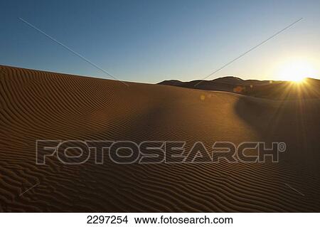 Picture - Morocco, Sand dune at dawn near Merzouga in Sahara Desert; Erg Chebbi area. Fotosearch