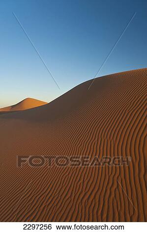 Morocco, Sand dune at dawn near Merzouga in Sahara Desert; Erg Chebbi area View Large Photo Image Stock Photograph - Morocco, Sand dune at dawn near Merzouga in Sahara Desert; Erg Chebbi area. Fotosearch