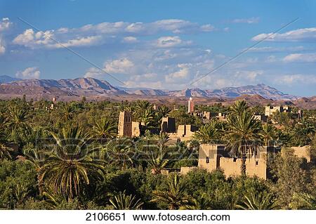 Morocco, seen from roof of Dar Ahlam Hotel; Skoura, Skoura Oasis with old kasbahs rising up above date palms View Large Photo Image Stock Image - Morocco, seen from roof of Dar Ahlam Hotel; Skoura, Skoura Oasis with old kasbahs rising up above date palms. Fotosearch