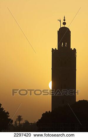 Morocco, Sun setting behind minaret of Koutoubia mosque; Marrakesh View Large Photo Image Stock Image - Morocco, Sun setting behind minaret of Koutoubia mosque; Marrakesh. Fotosearch