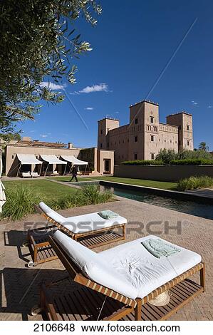 Morocco, Swimming pool and main Kasbah of Dar Ahlam hotel; Skoura View Large Photo Image Stock Photo - Morocco, Swimming pool and main Kasbah of Dar Ahlam hotel; Skoura. Fotosearch