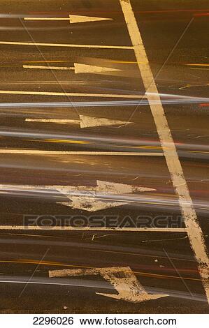 Stock Photograph - Morocco, Traffic going across busy junction at night; Casablanca. Fotosearch