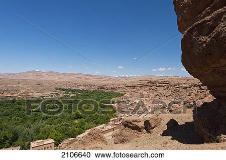 Stock Image - Morocco, Villages and greenery with Atlas mountains behind; Valley of Roses. Fotosearch