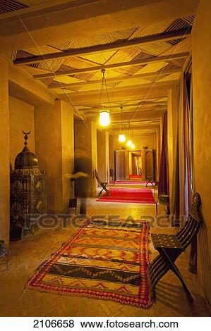 Stock Photo - Morocco, Waiter walking along corridor in Dar Ahlam Hotel; Skoura. Fotosearch