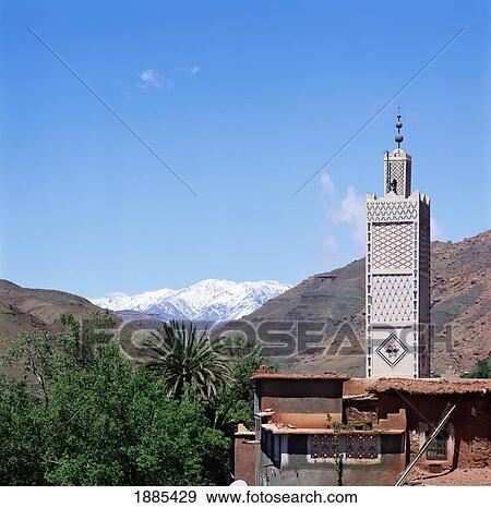 Stock Photo - Mosque And Atlas Mountains. Fotosearch