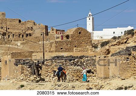 Mosque Of Chenini Overlooks Ruins Of A Berber Village In The Tataouine Province; Chenini, Tunisia, North Africa View Large Photo Image Stock Photography - Mosque Of Chenini Overlooks Ruins Of A Berber Village In The Tataouine Province; Chenini, Tunisia, North Africa. Fotosearch