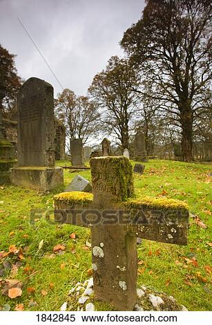 Stock Photography - Moss-Covered Gravestones; Argyl And Bute, Scotland, Uk. Fotosearch