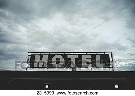 Stock Photo - Motel Sign Against A Cloudy Sky; Saint-Simeon Quebec Canada. Fotosearch