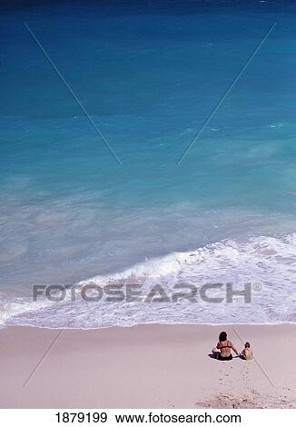 Stock Photo - Mother And Child On Beach. Fotosearch
