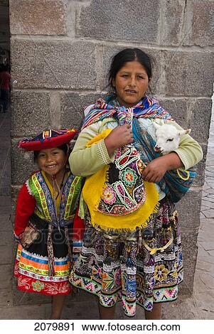 Mother And Child With Lamb, Cusco, Peru View Large Photo Image Stock Image - Mother And Child With Lamb, Cusco, Peru. Fotosearch
