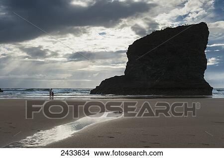Picture - Mother and daughter on beach at Bedruthan Steps; Cornwall, England. Fotosearch