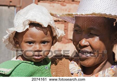 Stock Image - Mother And Her Girl In Ambalavao, Fianarantsoa Province, Madagascar. Fotosearch