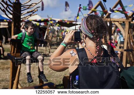 Mother and son at music festival; Dorset, England View Large Photo Image Stock Photo - Mother and son at music festival; Dorset, England. Fotosearch