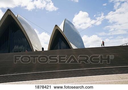Stock Image - Mother And Son Outside Sydney Opera House. Fotosearch
