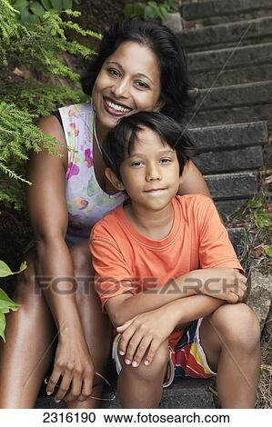 Mother And Son Sitting On Outside Steps; Ontario Canada View Large Photo Image Stock Image - Mother And Son Sitting On Outside Steps; Ontario Canada. Fotosearch