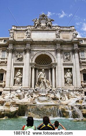 Stock Image - Mother And Sons At The Trevi Fountain. Fotosearch