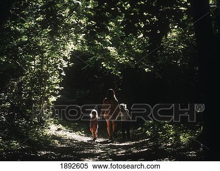Stock Photography - Mother And Two Daughters On Footpath On South Downs Way. Fotosearch