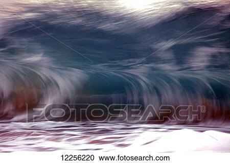 Stock Image - Motion blur of fast moving wave; Hawaii, United States of America. Fotosearch