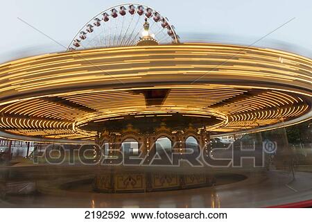 Stock Image - Motion Blur Of The Lights Of A Spinning Amusement Park Ride; Chicago Illinois United States Of America. Fotosearch