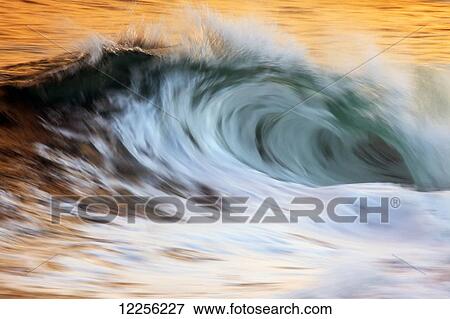 Stock Photo - Motion blur of wave; Hawaii, United States of America. Fotosearch