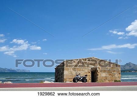 Motorbike Parked In S'albufereta Near Alcudia, Mallorca, Balearic Islands, Spain View Large Photo Image Stock Image - Motorbike Parked In S'albufereta Near Alcudia, Mallorca, Balearic Islands, Spain. Fotosearch