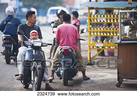 Stock Photo - Motorbikes On Streets Of Pemogan, Bali, Indonesia. Fotosearch