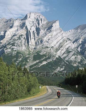 Motorcycling In The Mountains; Kananaskis, Alberta, Canada View Large Photo Image Stock Photography - Motorcycling In The Mountains; Kananaskis, Alberta, Canada. Fotosearch