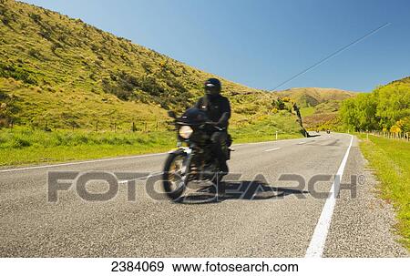Stock Photo - Motorcycling; South Island, New Zealand. Fotosearch