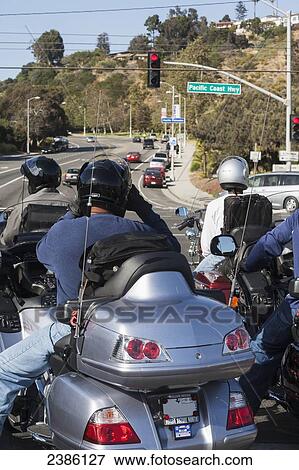 Motorcyclists on a busy road crossing the pacific coast highway; California, United States of America View Large Photo Image Stock Photo - Motorcyclists on a busy road crossing the pacific coast highway; California, United States of America. Fotosearch