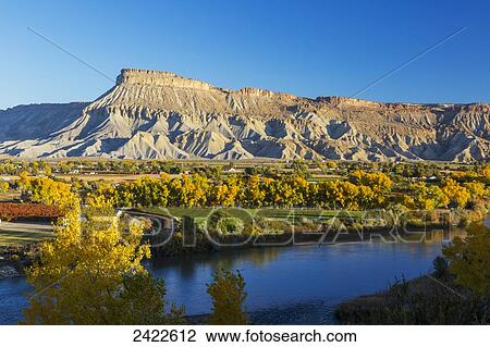 Mount Garfield at sunrise with the Colorado River and colourful autumn foliage in the foreground; Palisade, Colorado, United States of America View Large Photo Image Stock Image - Mount Garfield at sunrise with the Colorado River and colourful autumn foliage in the foreground; Palisade, Colorado, United States of America. Fotosearch