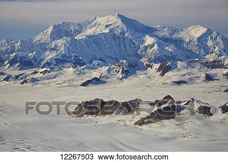 Stock Image - Mount Logan, Canada's highest peak, in Kluane National Park and Reserve; Yukon, Canada. Fotosearch