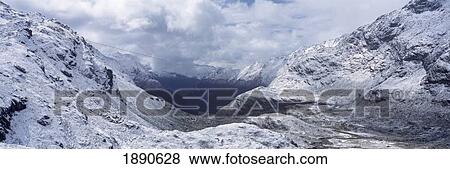 Mountain Pass Between Snowy Peaks View Large Photo Image Stock Photo - Mountain Pass Between Snowy Peaks. Fotosearch