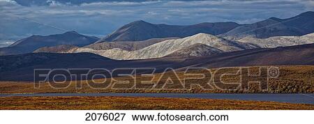 Stock Photo - Mountains Along The Dempster Highway At Sunset; Yukon Canada. Fotosearch