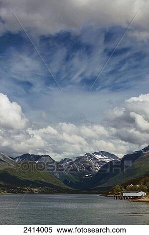 Stock Photography - Mountains and the shoreline of Rauma River; Andalsnes, Rauma, Norway. Fotosearch