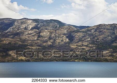 Stock Image - Mountains next to lake okanagan; british columbia canada. Fotosearch