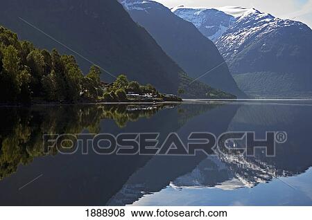 Stock Photo - Mountains Reflected In Waters Of Lovatn Lake. Fotosearch