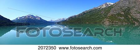 Stock Image - Mountains Reflected Into Atlin Lake In Atlin Provincial Park, British Columbia, Canada. Fotosearch