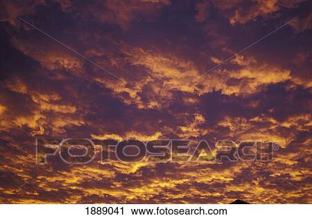 Mountaintop Silhouetted Against Pink And Purple Clouds View Large Photo Image Stock Image - Mountaintop Silhouetted Against Pink And Purple Clouds. Fotosearch