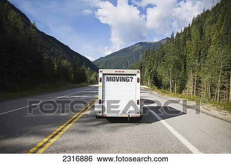 Stock Photograph - Moving Trailer Pulled By Car; British Columbia Canada. Fotosearch