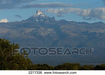 Stock Photograph - Mt Kenya in the evening as seen from Ol Pejeta Conservancy; Kenya. Fotosearch