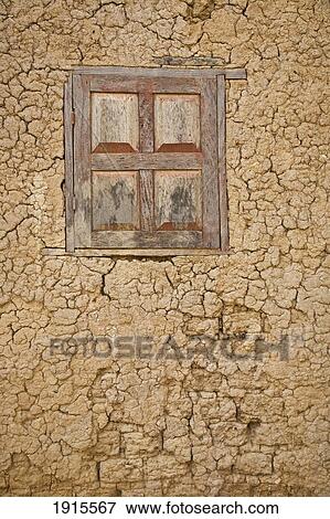 Stock Photo - Mud Wall With Wooden Window. Fotosearch
